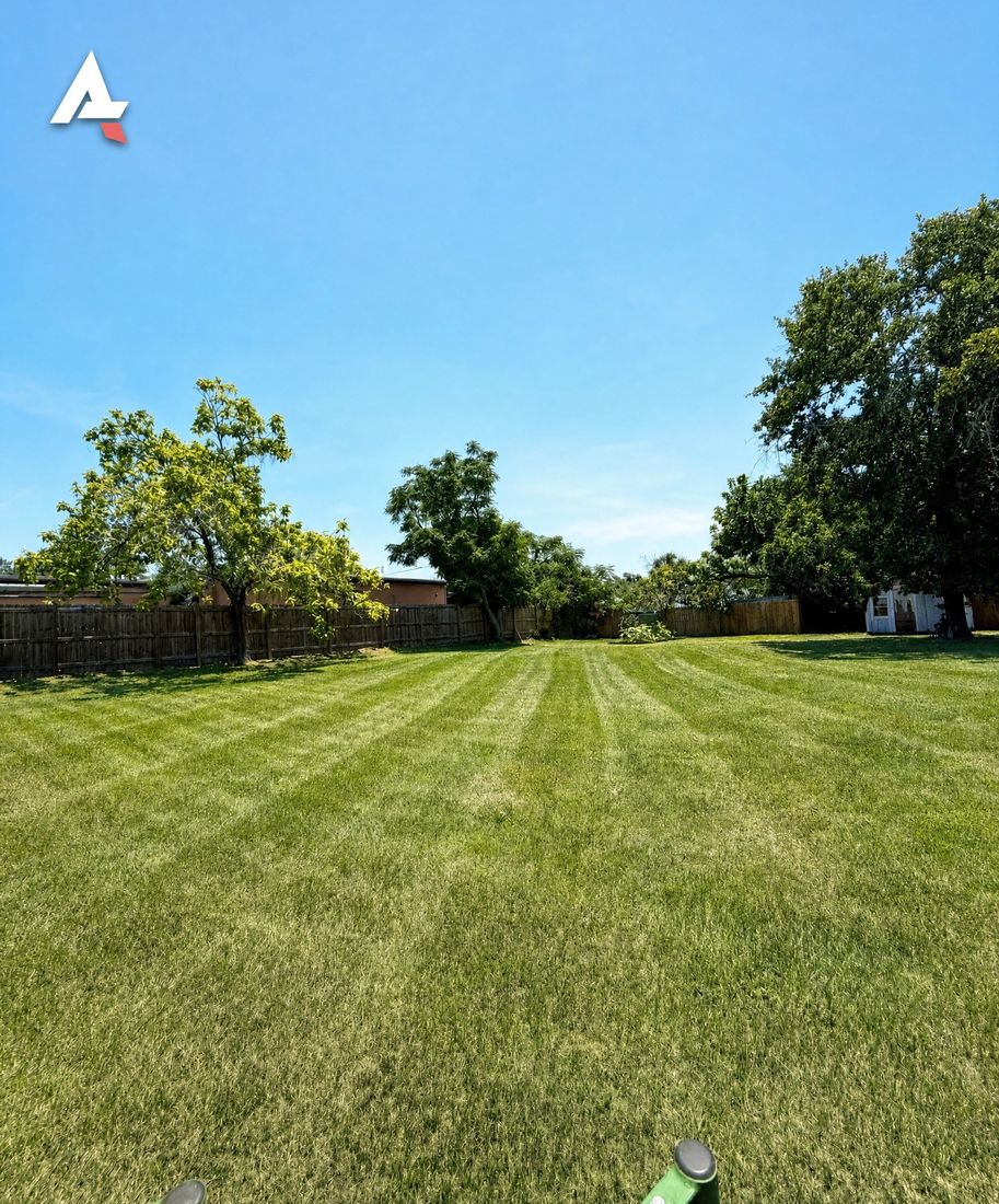 Freshly striped lawn mowed by Anything Exterior